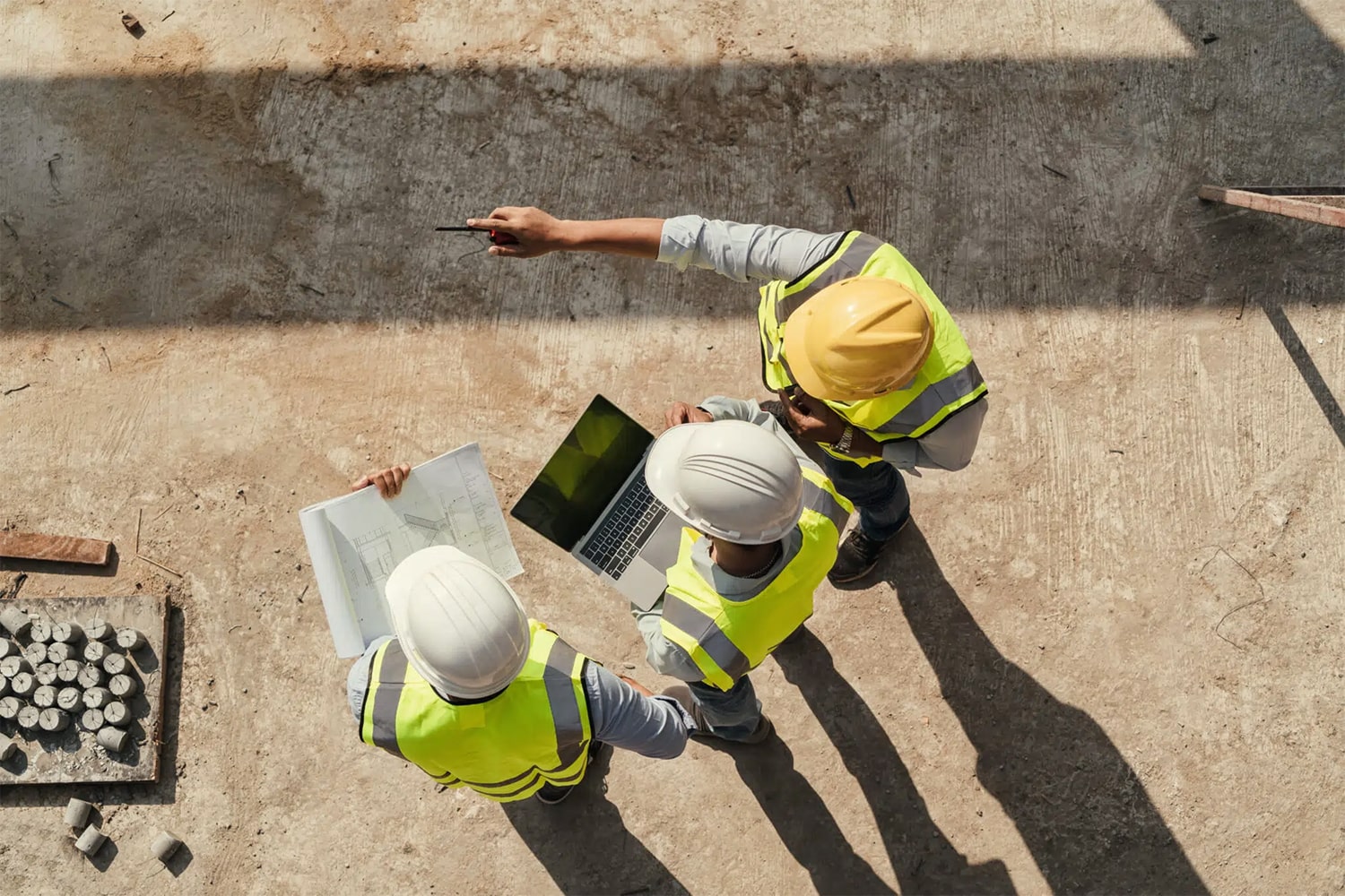 General contractor reviewing construction plans on site